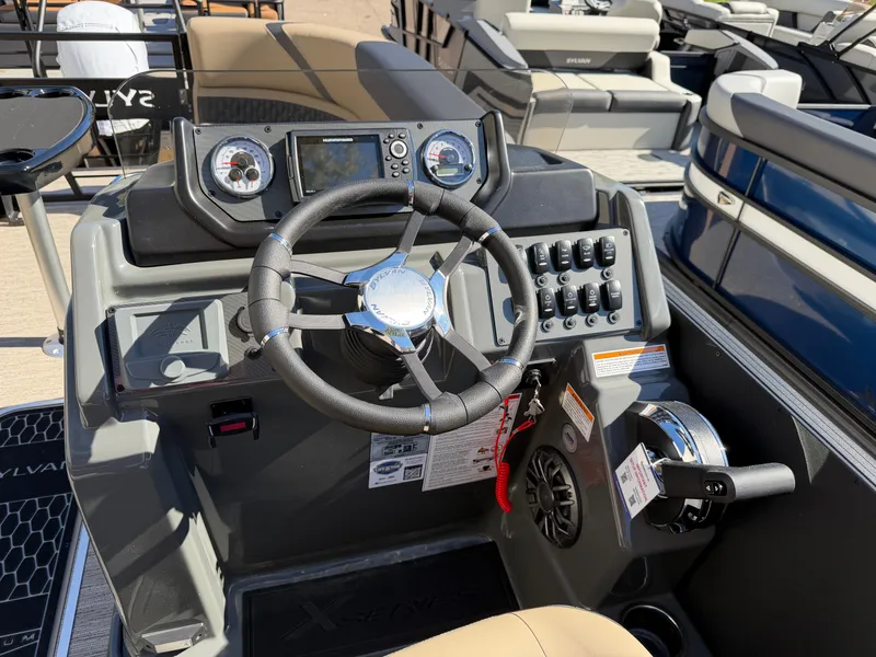 Slide: The Image of The image shows the helm of a 2027 Sylvan X3 ULZ with modern instruments. - 17