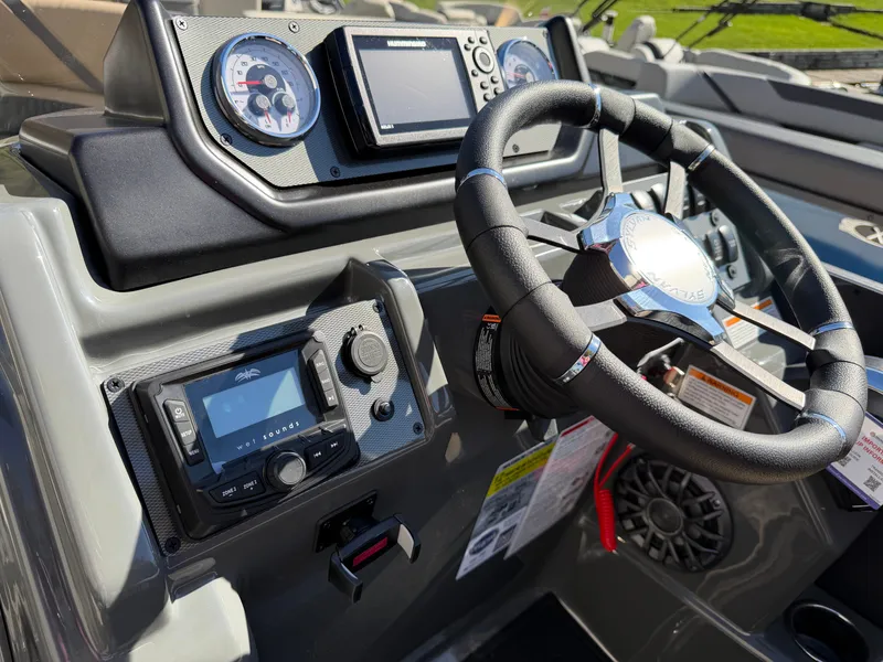Slide: The Image of The image shows the helm of a Sylvan X3 ULZ boat with modern instruments and a steering wheel. - 18
