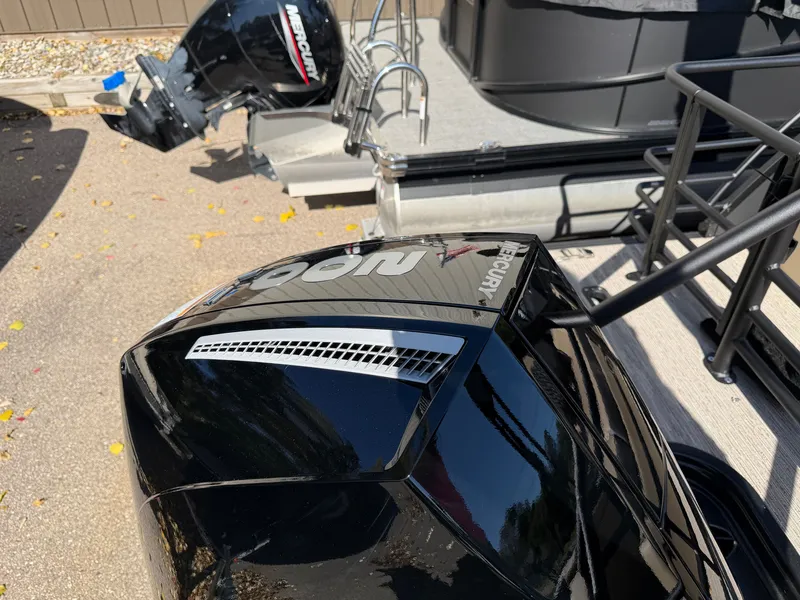 Slide: The Image of A black Mercury outboard motor is attached to a boat. - 29