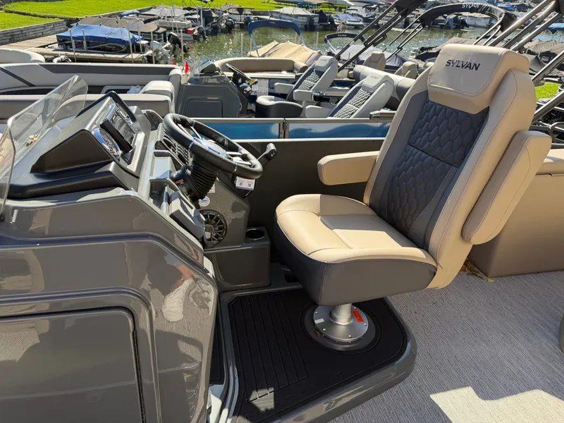 Slide: The Image of The image shows the helm of a 2027 Sylvan X3 ULZ with a cushioned captain's chair. - 15