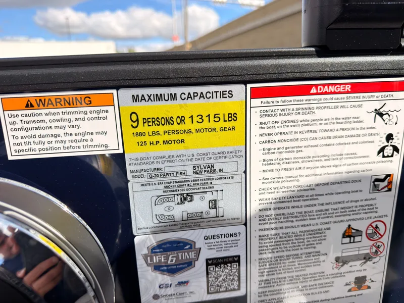 Slide: The Image of Safety and capacity labels on a Sylvan Q-20 Party Fish boat. - 43