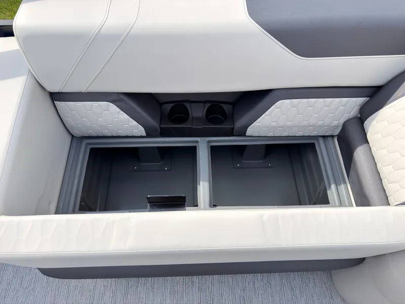 Slide: The Image of The 2027 Sylvan Q-20 Party Fish features an open storage compartment with cushioned seating. - 46