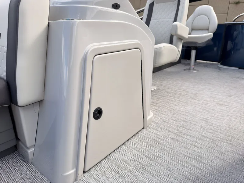 Slide: The Image of The image shows the interior of a 2027 Sylvan Q-20 Party Fish with modern seating. - 27