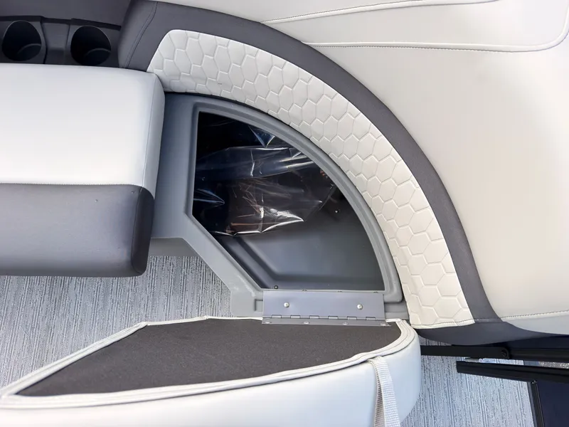 Slide: The Image of Close-up of a seating area with gray and white upholstery featuring a honeycomb pattern. - 16
