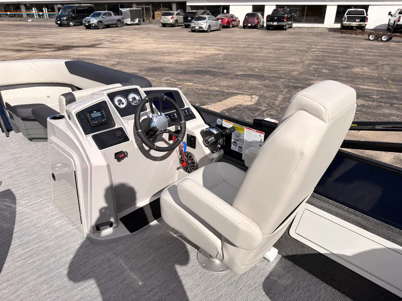 Slide: The Image of The image shows the cockpit of a 2027 Sylvan Q-20 Party Fish with a comfortable captain's chair. - 32