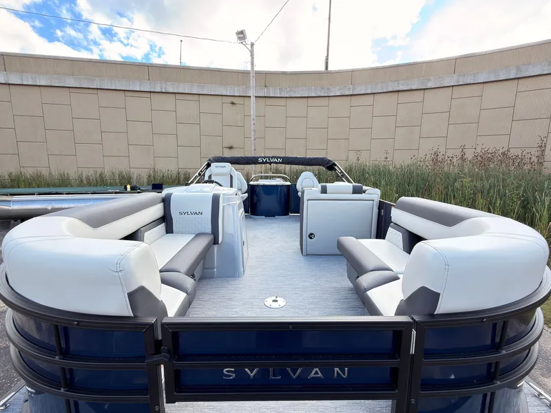 Slide: The Image of The image shows a 2027 Sylvan Q-20 Party Fish boat with spacious seating areas and modern design. - 10