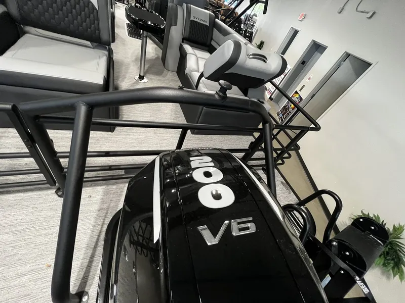 Slide: The Image of The image shows the interior of a 2027 Sylvan X3 SLZ with a V6 engine. - 23