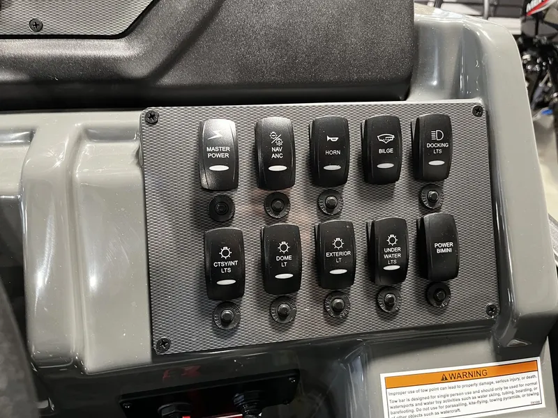 Slide: The Image of Control panel with various switches for boat functions, including lighting and anchor control. - 13