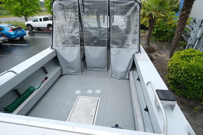 Slide: The Image of 2016 Hewescraft 210 Sea Runner ET Hardtop boat interior with protective covers. - 8