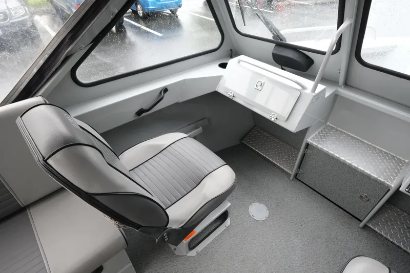 Slide: The Image of 2016 Hewescraft 210 Sea Runner ET Hardtop interior with seating and storage compartments. - 16