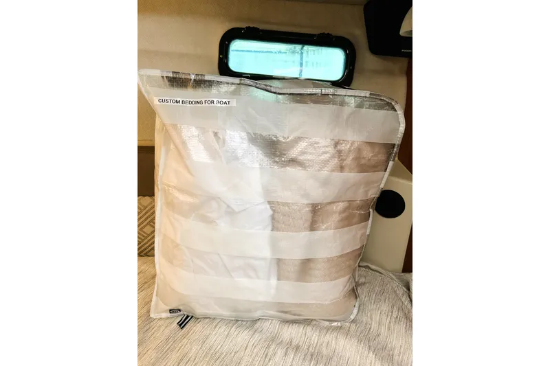 Slide: The Image of Custom boat bedding package inside a 2022 Ranger Tugs R-27 cabin. - 12
