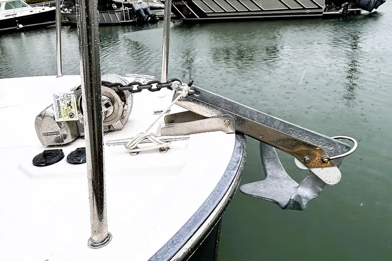 Slide: The Image of Bow of 2022 Ranger Tugs R-27 with anchor and winch system in marina. - 2