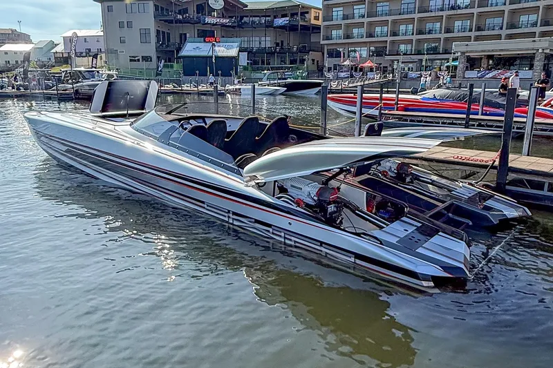 Slide: The Image of 2020 Skater 368 powerboat docked at marina, showcasing sleek design and powerful engines. - 3