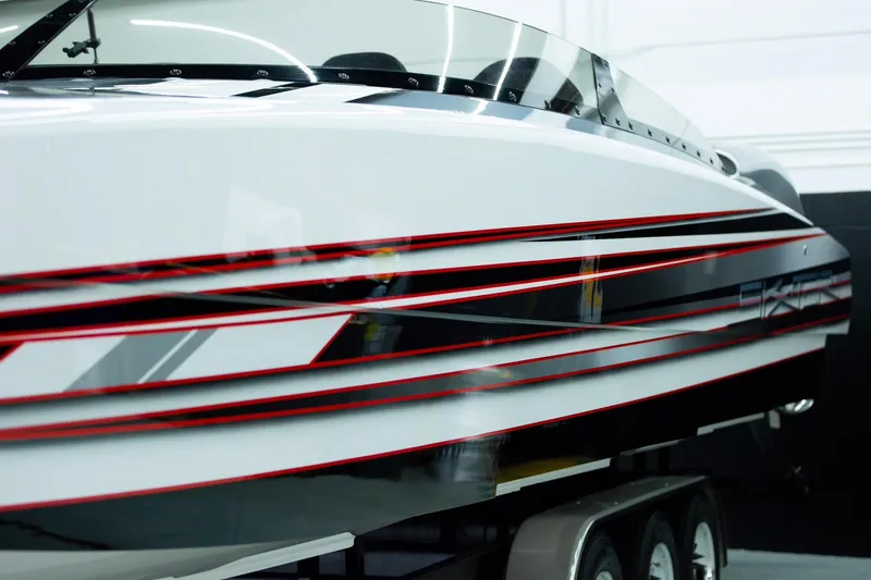 Slide: The Image of 2020 Skater 368 speedboat with sleek design and red accents on a trailer. - 9