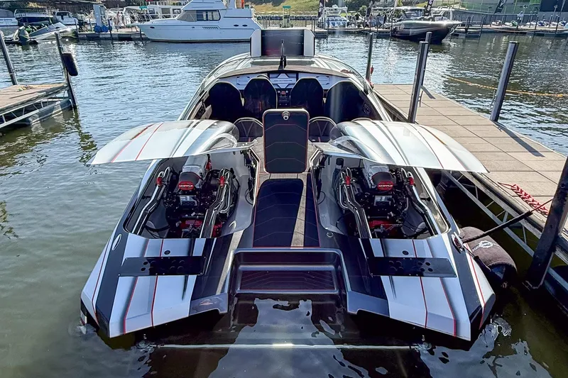 Slide: The Image of High-performance Skater 368 speedboat with open engine compartments docked at marina, 2020 model. - 4