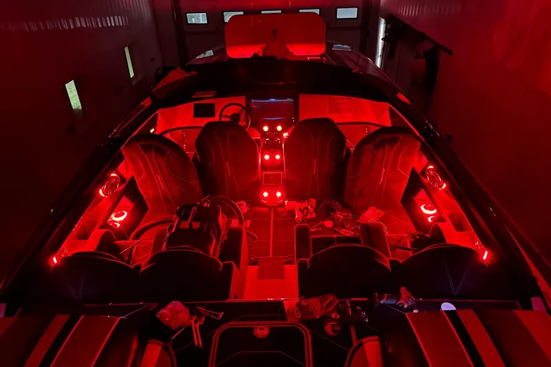 Slide: The Image of Interior of a 2020 Skater 368 boat with vibrant red ambient lighting. - 13