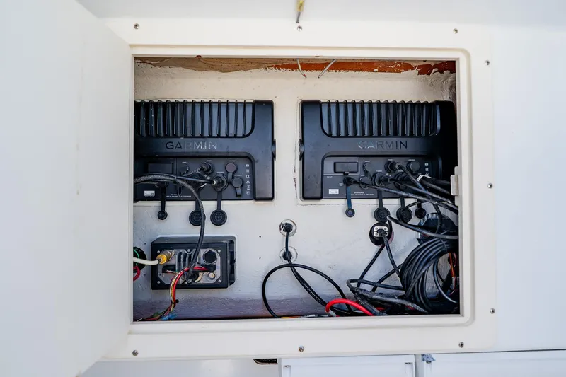 Slide: The Image of Electrical panel with Garmin devices on a 2016 Andros 32 Offshore boat. - 39