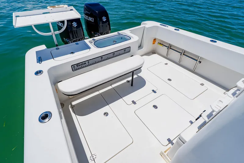 Slide: The Image of 2016 Andros 32 Offshore boat deck with Suzuki engines, spacious layout, and fishing amenities. - 63