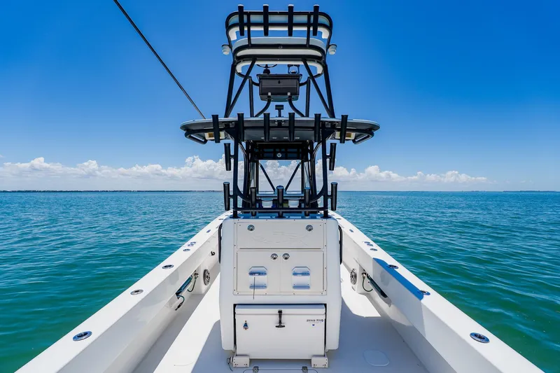 Slide: The Image of 2016 Andros 32 Offshore boat on open sea under clear blue sky. - 60