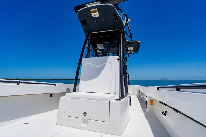 Slide: The Image of 2016 Andros 32 Offshore boat on open water under clear blue sky. - 33