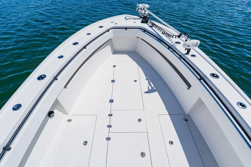 Slide: The Image of 2016 Andros 32 Offshore boat deck with storage compartments, surrounded by calm blue water. - 23