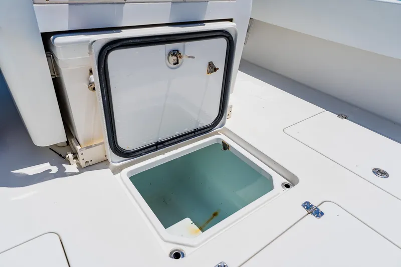 Slide: The Image of Andros 32 Offshore 2016 boat storage compartment with open hatch on deck. - 73