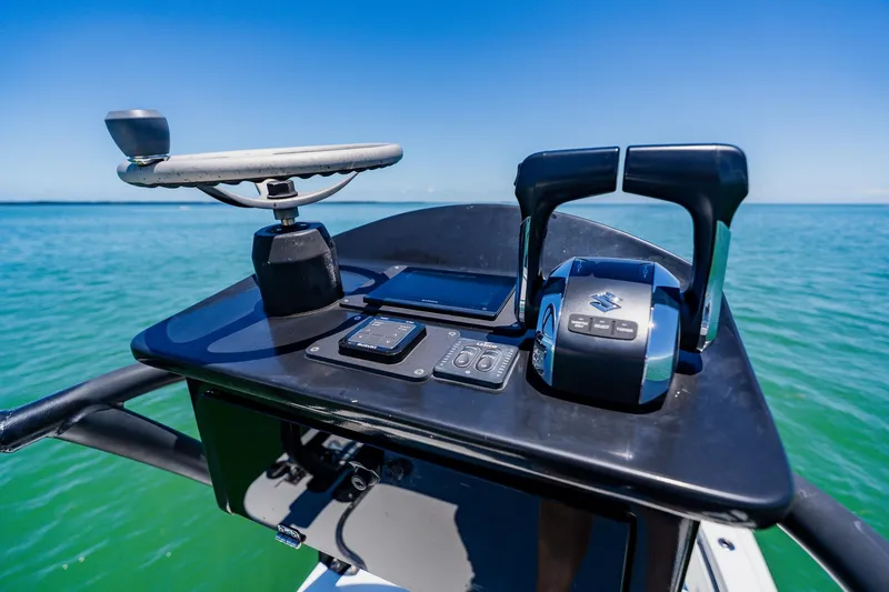 Slide: The Image of Helm of 2016 Andros 32 Offshore boat with controls and steering wheel. - 85