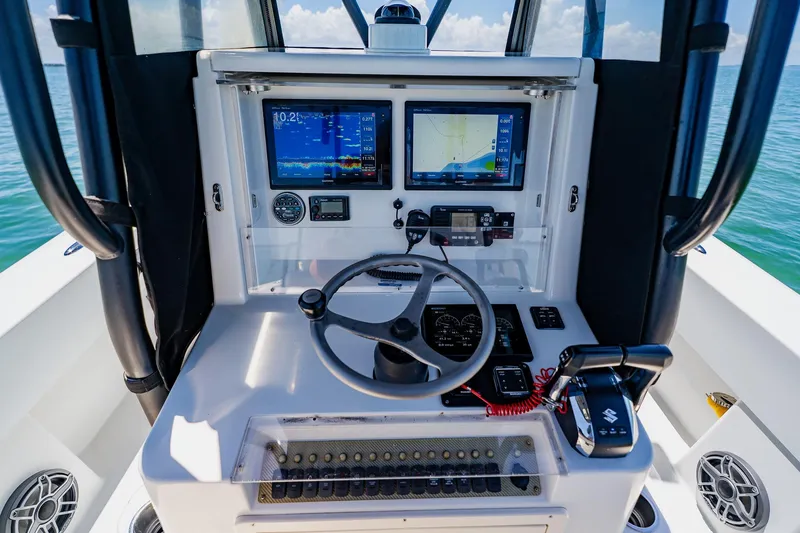 Slide: The Image of Andros 32 Offshore 2016 boat dashboard with navigation screens and controls. - 47