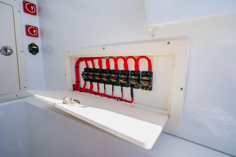 Slide: The Image of Electrical panel with red wiring on a 2016 Andros 32 Offshore boat. - 43