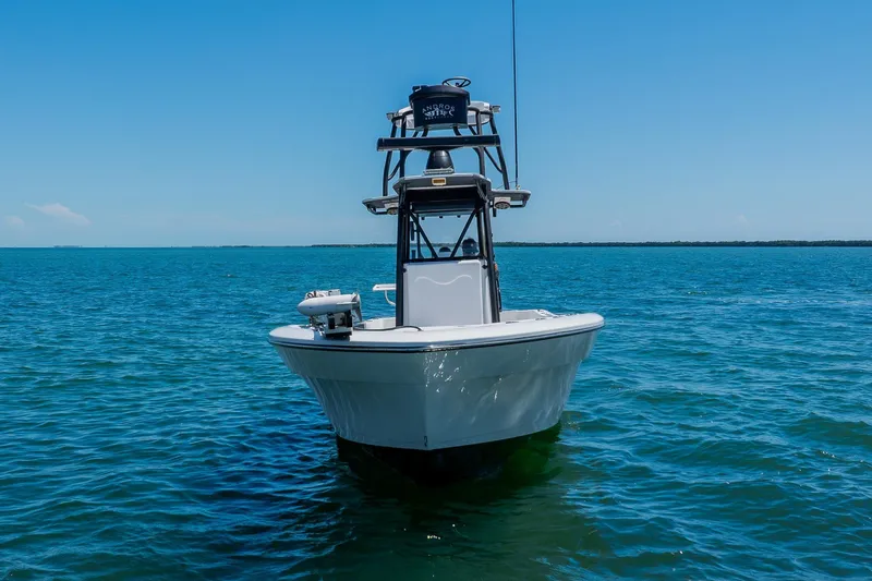 Slide: The Image of 2016 Andros 32 Offshore boat on calm blue water under clear sky. - 9