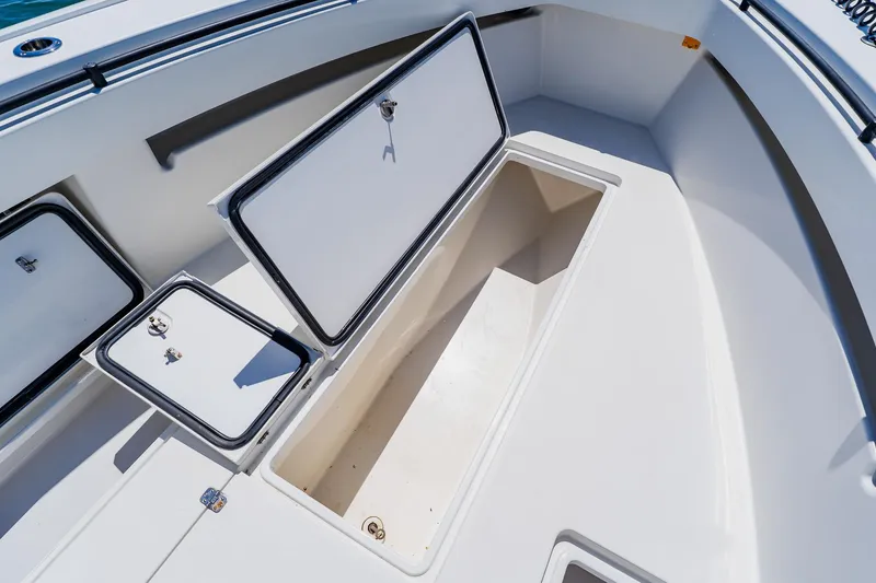 Slide: The Image of Open storage compartments on a 2016 Andros 32 Offshore boat deck. - 29
