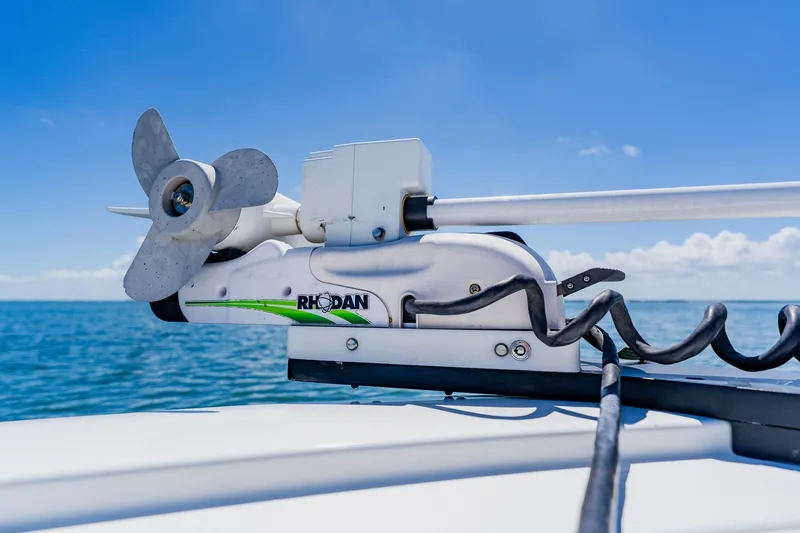Slide: The Image of Trolling motor on 2016 Andros 32 Offshore boat against clear blue sky and ocean. - 25