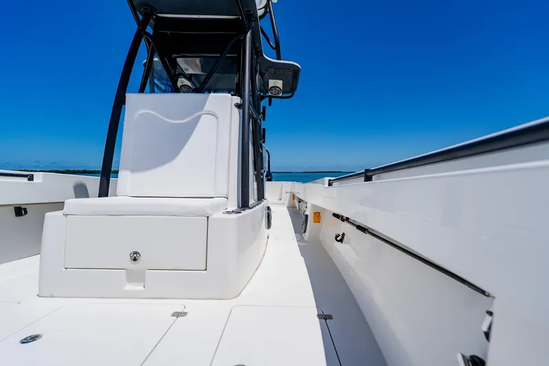 Slide: The Image of 2016 Andros 32 Offshore boat deck with seating, under clear blue sky. - 35