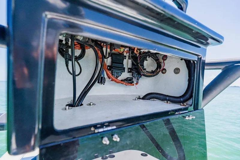 Slide: The Image of Electrical wiring inside a 2016 Andros 32 Offshore boat, showcasing detailed components. - 87