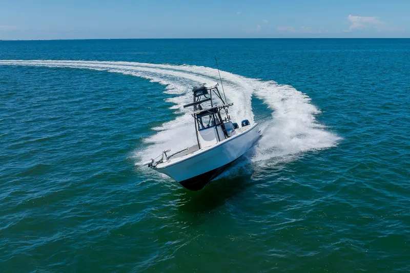 Slide: The Image of 2016 Andros 32 Offshore boat cruising swiftly on open blue ocean waters. - 18