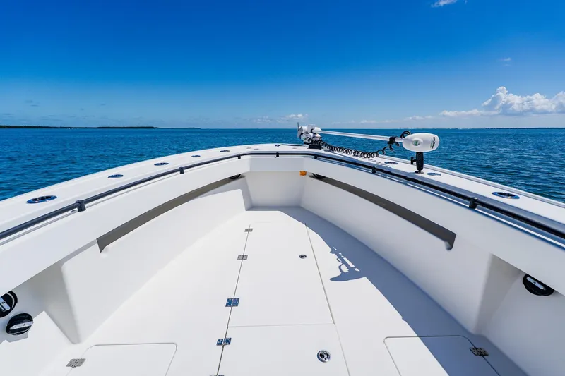 Slide: The Image of 2016 Andros 32 Offshore boat on open sea under clear blue sky. - 22