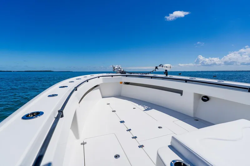Slide: The Image of 2016 Andros 32 Offshore boat on open sea under clear blue sky. - 20