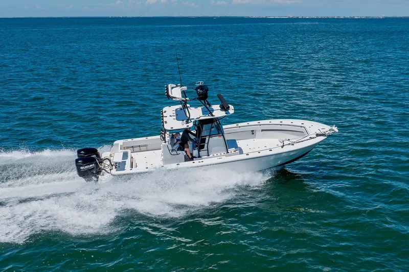 Slide: The Image of 2016 Andros 32 Offshore boat cruising on open blue water. - 17
