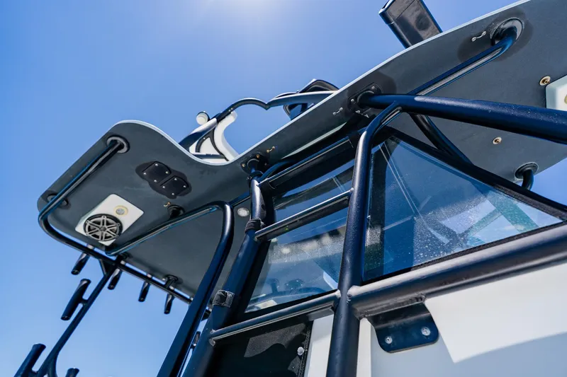 Slide: The Image of 2016 Andros 32 Offshore boat, close-up of tower and ladder against clear blue sky. - 82