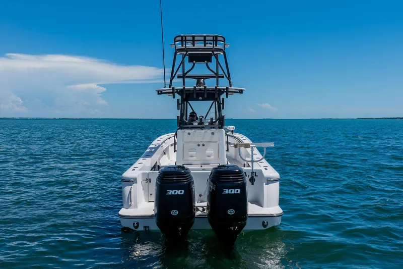 Slide: The Image of 2016 Andros 32 Offshore boat with dual 300 horsepower engines on open water. - 5