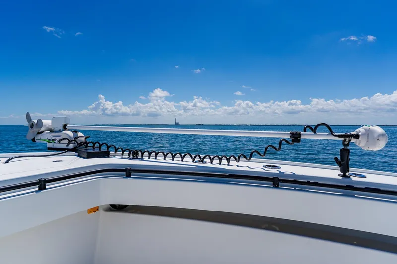 Slide: The Image of 2016 Andros 32 Offshore boat on calm blue sea under clear sky. - 24