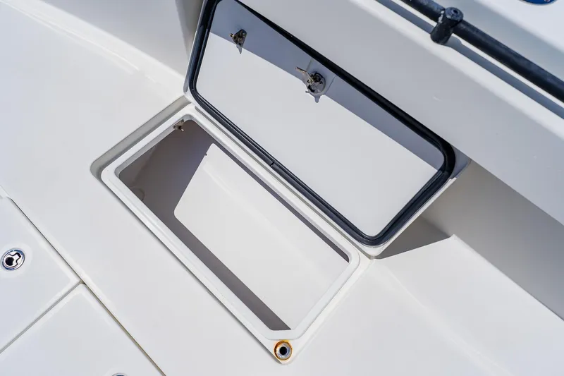 Slide: The Image of Open storage compartment on a 2016 Andros 32 Offshore boat deck. - 30