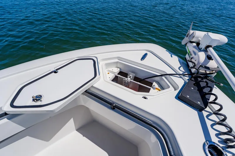 Slide: The Image of 2016 Andros 32 Offshore boat deck with open storage compartments and trolling motor. - 26