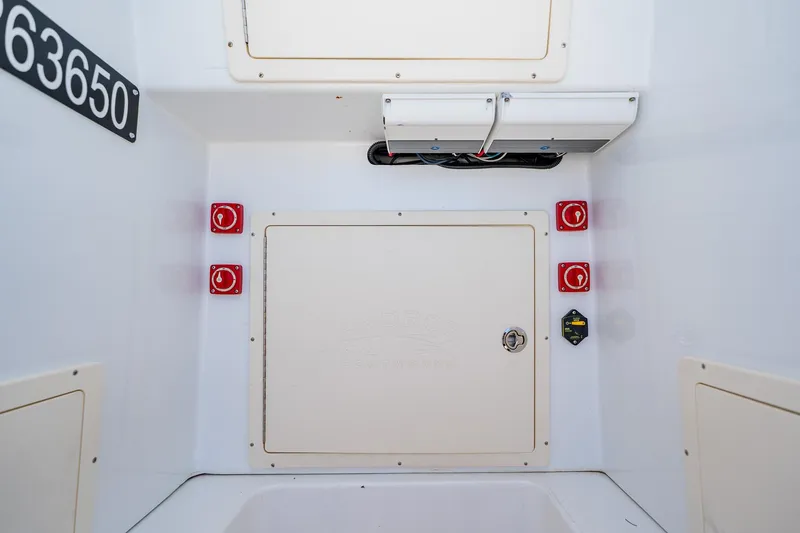 Slide: The Image of Electrical panel of a 2016 Andros 32 Offshore boat with switches and wiring. - 41