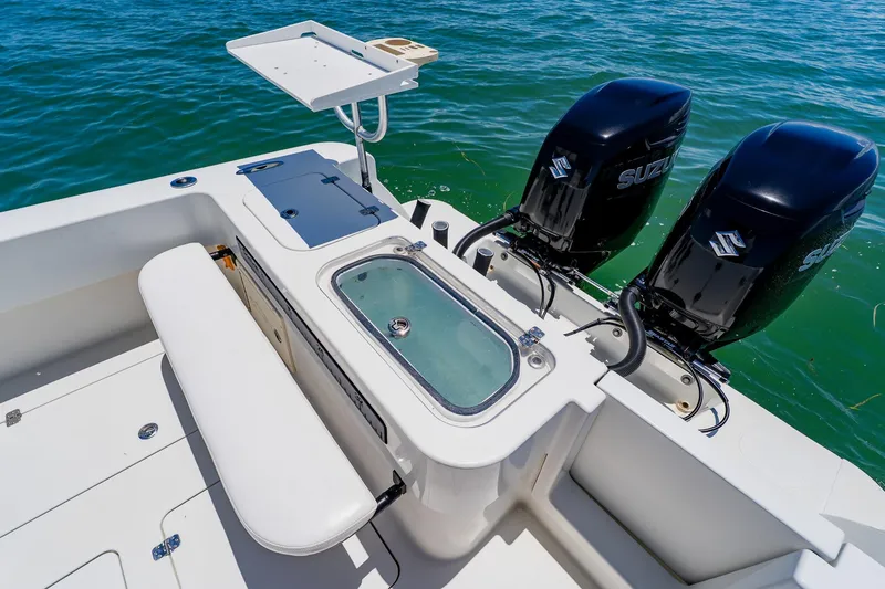 Slide: The Image of 2016 Andros 32 Offshore boat with dual Suzuki engines and fishing station on open water. - 66
