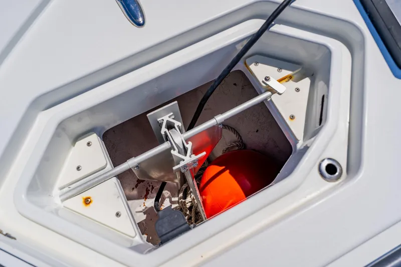 Slide: The Image of Anchor compartment of 2016 Andros 32 Offshore boat with visible orange buoy. - 27