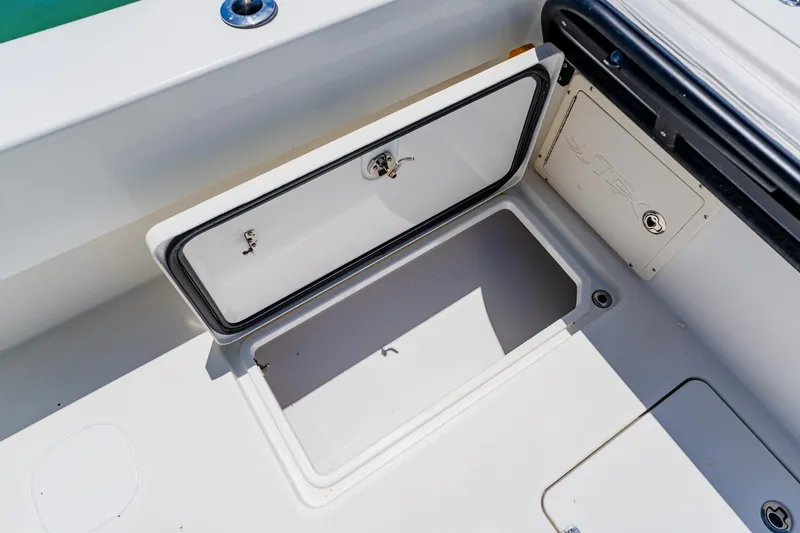 Slide: The Image of Open storage compartment on a 2016 Andros 32 Offshore boat. - 75