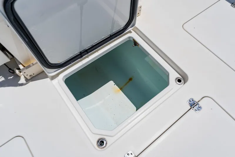 Slide: The Image of Open storage compartment on 2016 Andros 32 Offshore boat deck. - 74