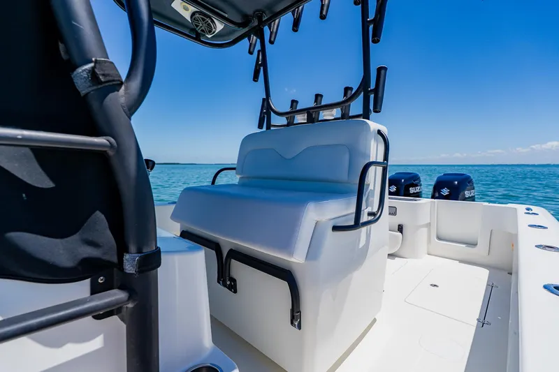 Slide: The Image of 2016 Andros 32 Offshore boat interior with seating and dual Suzuki engines. - 52