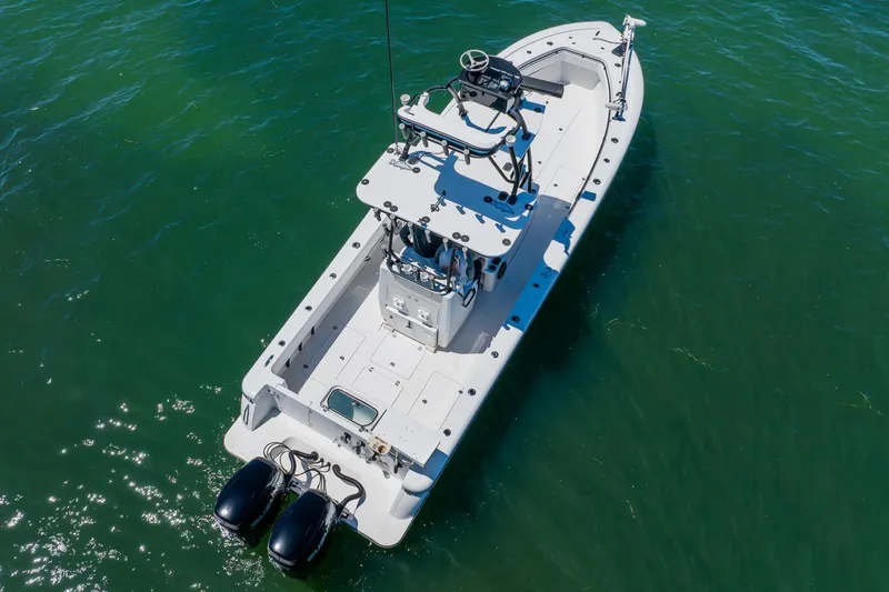 Slide: The Image of 2016 Andros 32 Offshore boat with dual engines on clear water. - 10
